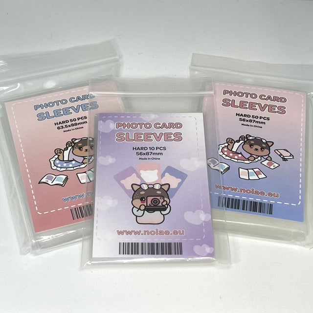 Three packs of Nolae hard photocard sleeves in pink, purple and blue